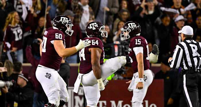 Texas A&M offensive line celebrates with Conner Weigman